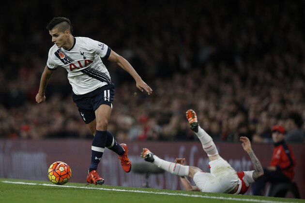Tottenham Hotspur's Argentinian midfielder Erik Lamela (L) runs during the English Premier League football match between Arsenal and Tottenham Hotspur at the Emirates Stadium in London on November 8, 2015.     AFP PHOTO / ADRIAN DENNIS

RESTRICTED TO EDITORIAL USE. No use with unauthorized audio, video, data, fixture lists, club/league logos or 'live' services. Online in-match use limited to 75 images, no video emulation. No use in betting, games or single club/league/player publications.        (Photo credit should read ADRIAN DENNIS/AFP/Getty Images)