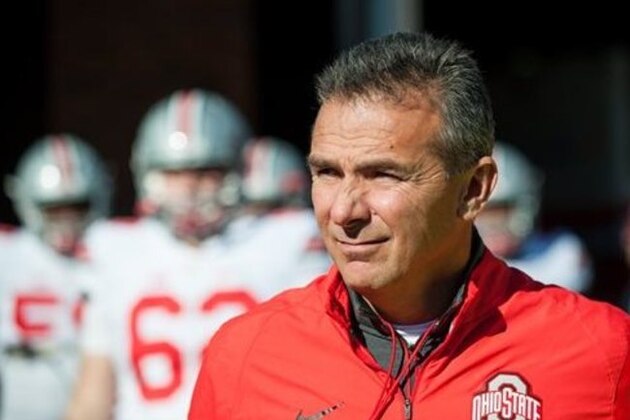 Ohio State head coach Urban Meyer takes the field for warm ups before an NCAA football game against Illinois Saturday, Nov. 14, 2015 at Memorial Stadium in Champaign, Ill.  (AP Photo/Bradley Leeb)