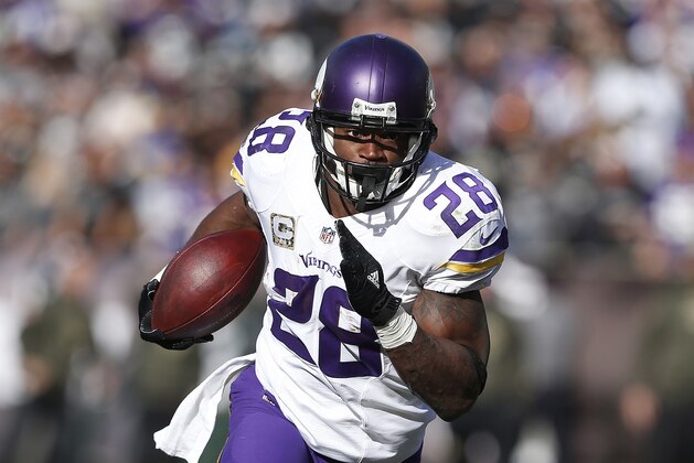 Minnesota Vikings running back Adrian Peterson (28) runs against the Oakland Raiders during the first half of an NFL football game in Oakland, Calif., Sunday, Nov. 15, 2015. The Vikings won 30-14. (AP Photo/Beck Diefenbach)