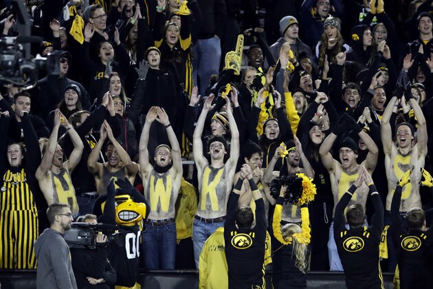 Iowa fans cheer for their team during the second half of an NCAA college football game against Minnesota, Saturday, Nov.14, 2015, in Iowa City, Iowa.  Iowa won 40-35. (AP Photo/Nam Y. Huh)