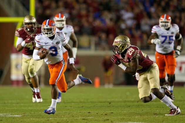 TALLAHASSEE, FL - NOVEMBER 29:  Treon Harris #3 of the Florida Gators rushes during a game against the Florida State Seminoles  at Doak Campbell Stadium on November 29, 2014 in Tallahassee, Florida.  (Photo by Mike Ehrmann/Getty Images)