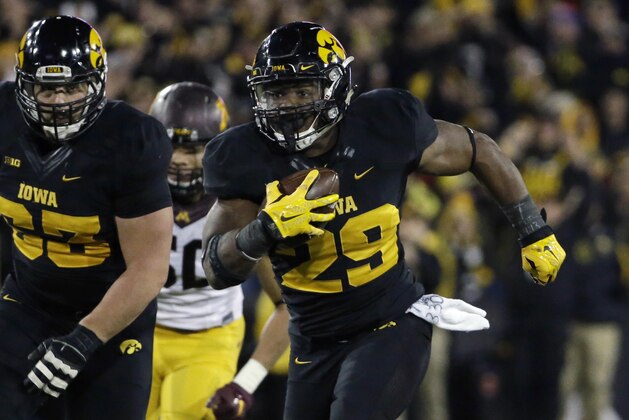 Iowa running back LeShun Daniels, Jr. (29) runs for a touchdown during the second half of an NCAA college football game against Minnesota, Saturday, Nov. 14, 2015, in Iowa City, Iowa. Iowa won 40-35. (AP Photo/Nam Y. Huh)