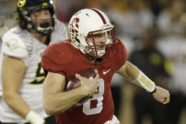 Stanford's Kevin Hogan rushes against Oregon during the first quarter of an NCAA college football game Saturday, Nov. 14, 2015, in Stanford, Calif. (AP Photo/Ben Margot)