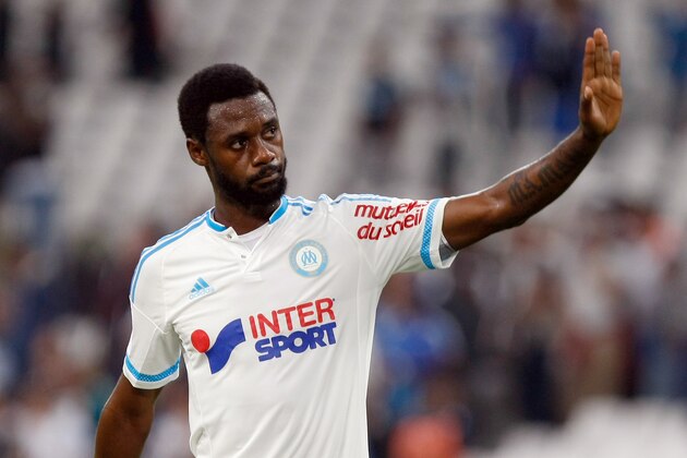 Marseille's Cameroonian defender Nicolas NKoulou waves to supporters during the League One soccer match between Marseille and Bastia, at the Velodrome Stadium, in Marseille, southern France, Sunday, Sept. 13, 2015. (AP Photo/Claude Paris)