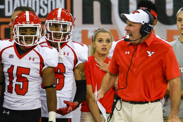 Youngstown State head coach Bo Pelini yells on the sideline during an NCAA college football game against South Dakota in Vermillion, S.D., Saturday, Oct. 3, 2015. Pelini brought his new team to this town seven miles north of the Nebraska state line, an area deep within the Huskers’ sphere of influence, and fans were lying in wait. They haven’t forgotten Pelini’s signature sideline meltdowns, his dour demeanor and the leaked audio recordings of him ripping the fans and using vulgarities to describe the athletic director in his final meeting with players. (AP Photo/Nati Harnik)