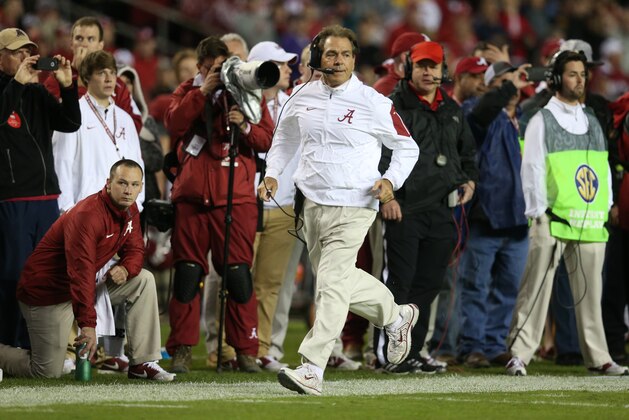 Alabama head coach Nick Saban runs down the sidelines during a play against LSU in the second half of an NCAA college football game Saturday, Nov. 7, 2015, in Tuscaloosa , Ala. (AP Photo/John Bazemore)