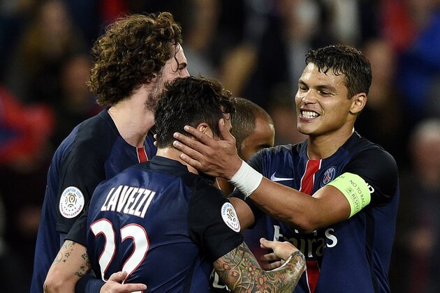 Paris Saint-Germain's Argentinian midfielder Ezequiel Lavezzi (C) is congratulated by Paris Saint-Germain's Brazilian defender Thiago Silva (R) after scoring a goal during the French L1 football match between Paris Saint-Germain (PSG) vs Toulouse on November 7, 2015 at the Parc des Princes stadium in Paris. AFP PHOTO / FRANCK FIFE        (Photo credit should read FRANCK FIFE/AFP/Getty Images)
