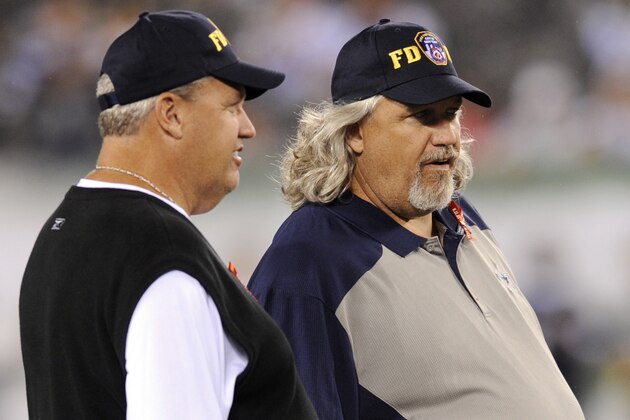 Dallas Cowboys defensive coordinator Rob Ryan, right, waits with his brother New York Jets head coach Rex Ryan before an NFL football game between the Cowboys and Jets on Sunday, Sept. 11, 2011,  in East Rutherford, N.J. (AP Photo/Bill Kostroun)