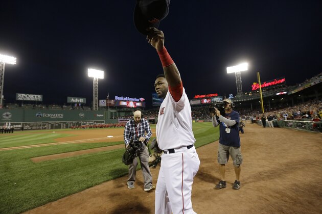 Boston Red Sox designated hitter David Ortiz waves to the crowd before ceremonies to honor his 500 home runs before a baseball game against the Tampa Bay Rays, Monday, Sept. 21, 2015, at Fenway Park, in Boston. (AP Photo/Steven Senne)