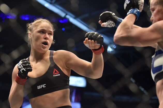 Ronda Rousey of the US (L) lines up compatriot Holly Holm during the UFC title fight in Melbourne on November 15, 2015.   RESTRICTED TO EDITORIAL USE NO ADVERTISING USE NO PROMOTIONAL USE NO MERCHANDISING USE.  AFP PHOTO/Paul CROCK        (Photo credit should read PAUL CROCK/AFP/Getty Images)