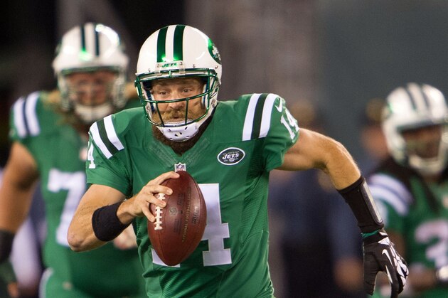 Nov 12, 2015; East Rutherford, NJ, USA;  New York Jets quarterback Ryan Fitzpatrick (14) runs the ball in the 2nd half against the Buffalo Bills at MetLife Stadium.The Bills defeated the Jets 22-17 Mandatory Credit: William Hauser-USA TODAY Sports