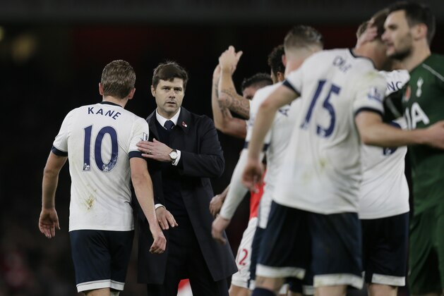 Tottenham manager Mauricio Pochettino, second left, greets Tottenham’s Harry Kane, left, after the English Premier League soccer match between Arsenal and Tottenham Hotspur at the Emirates Stadium in London, Sunday Nov. 8, 2015. (AP Photo/Tim Ireland)