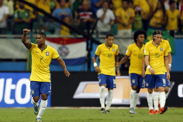Brazil's Douglas Costa, left, celebrates after scoring during a 2018 World Cup qualifying soccer match against Peru in Salvador, Brazil, Tuesday, Nov. 17, 2015. (AP Photo/Andre Penner)