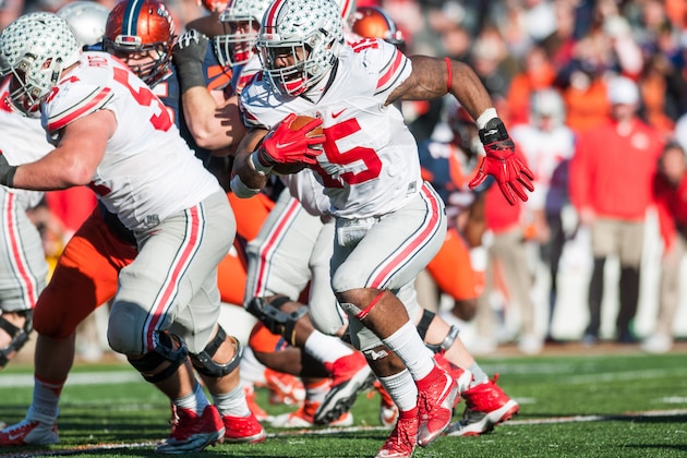 Ohio State running back Ezekiel Elliott (15) runs the ball during the second half of an NCAA football game against Illinois, Saturday, Nov. 14, 2015, at Memorial Stadium in Champaign, Ill. Ohio State won 28-3. (AP Photo/Bradley Leeb)