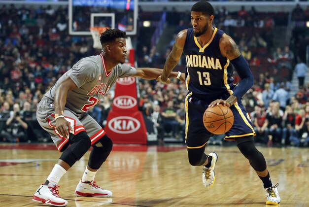 Nov 16, 2015; Chicago, IL, USA; Indiana Pacers forward Paul George (13) drives against Chicago Bulls guard Jimmy Butler (21) during the first half at United Center. Mandatory Credit: Kamil Krzaczynski-USA TODAY Sports