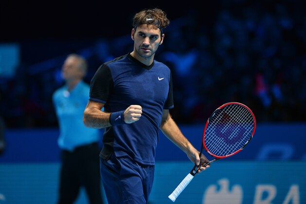 Switzerland's Roger Federer celebrates winning a point against Serbia's Novak Djokovic during their men's singles group stage match on day three of the ATP World Tour Finals tennis tournament in London on November 17, 2015. Federer won the match 7-5, 6-2.     AFP PHOTO / GLYN KIRK        (Photo credit should read GLYN KIRK/AFP/Getty Images)