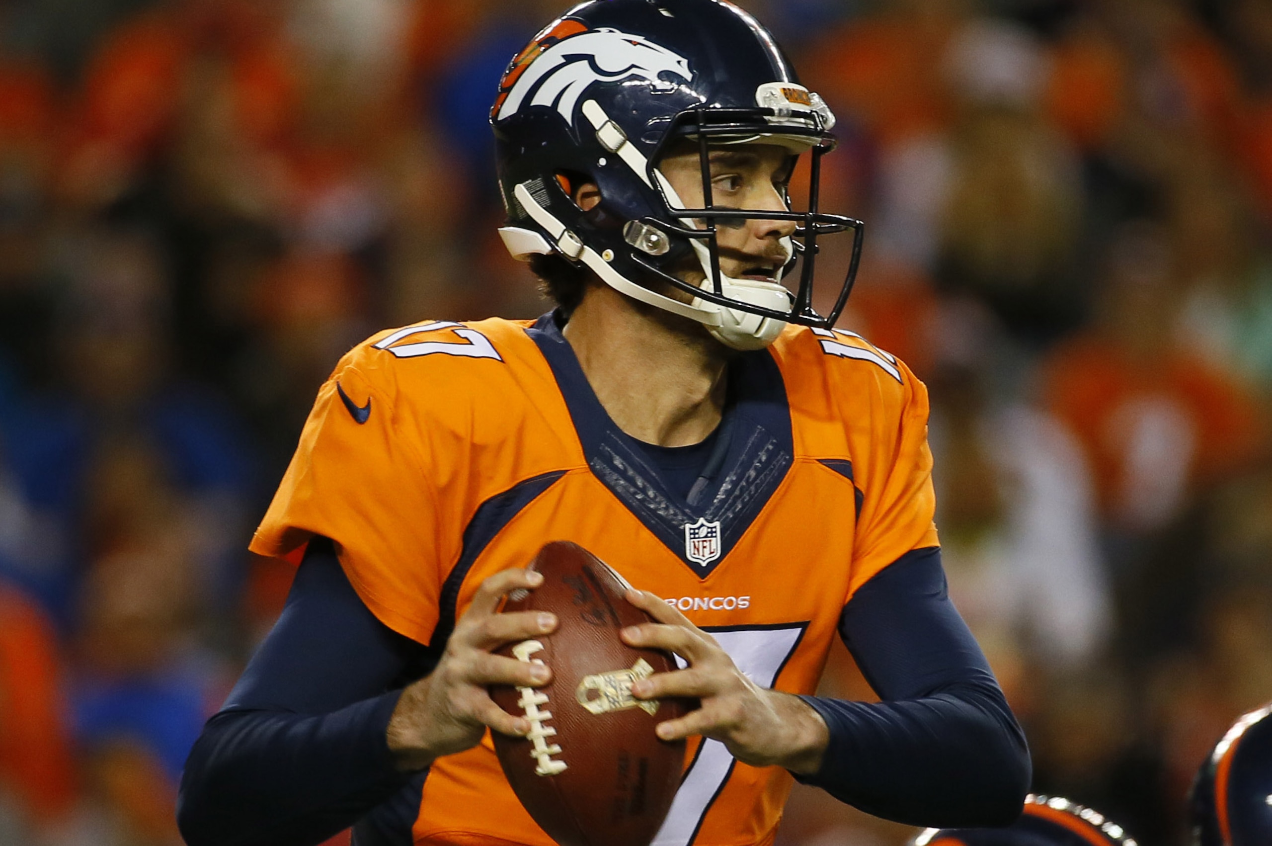 Denver Broncos quarterback Brock Osweiler (17) scrambles during the second half of an NFL football game against the Kansas City Chiefs, Sunday, Nov. 15, 2015, in Denver. (AP Photo/Joe Mahoney)
