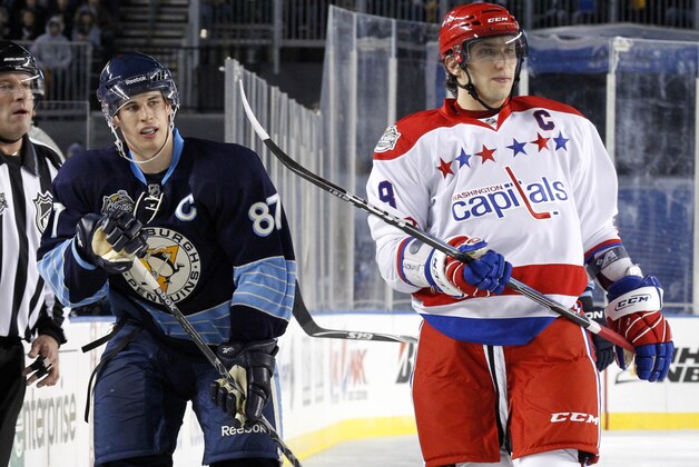 Washington Capitals' Alex Ovechkin, right, and Pittsburgh Penguins' Sidney Crosby (87) skate during the second period of the NHL Winter Classic outdoor hockey game against the Pittsburgh Penguins in Pittsburgh Saturday, Jan. 1, 2011. The Capitals won 3-1.   (AP Photo/Gene J. Puskar)