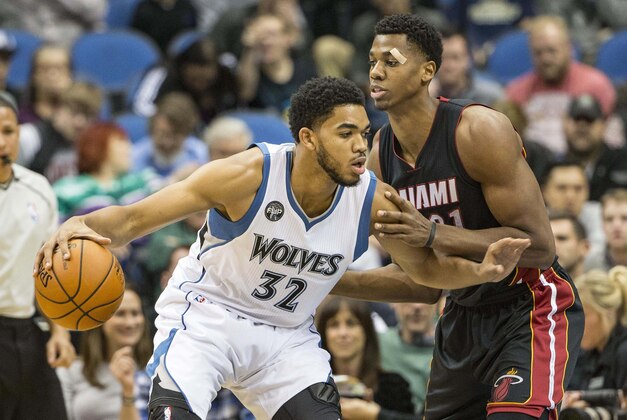 Nov 5, 2015; Minneapolis, MN, USA; Minnesota Timberwolves center Karl-Anthony Towns (32) drives to the basket through defense from Miami Heat center Hassan Whiteside (21) in the first half at Target Center. Mandatory Credit: Jesse Johnson-USA TODAY Sports