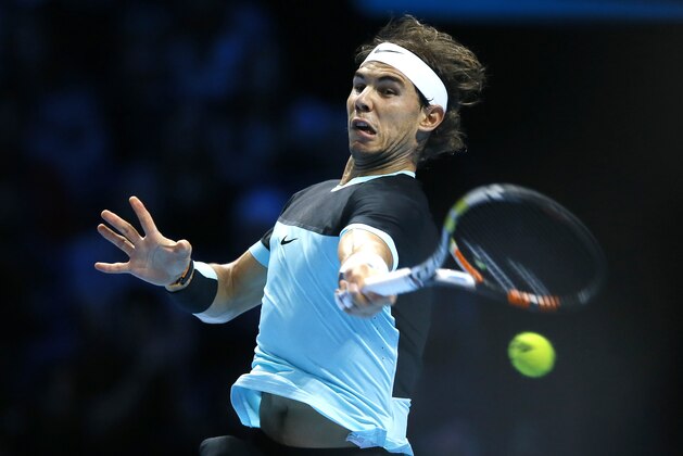 Rafael Nadal of Spain plays a return to Andy Murray of Britain during their singles tennis match at the ATP World Tour Finals at the O2 Arena in London, Wednesday, Nov. 18, 2015. (AP Photo/Kirsty Wigglesworth)
