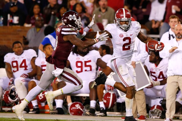 STARKVILLE, MS - NOVEMBER 14:  Derrick Henry #2 of the Alabama Crimson Tide breaks a tackle attempt by Kivon Coman #11 of the Mississippi State Bulldogs on the way to a touchdown at Davis Wade Stadium on November 14, 2015 in Starkville, Mississippi.  (Photo by Kevin C. Cox/Getty Images)