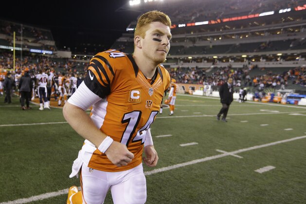 Cincinnati Bengals quarterback Andy Dalton (14) walks off the field following a 10-6 loss to the Houston Texans in the second half of an NFL football game in Cincinnati, Monday, Nov. 16, 2015.  (AP Photo/Michael Conroy)