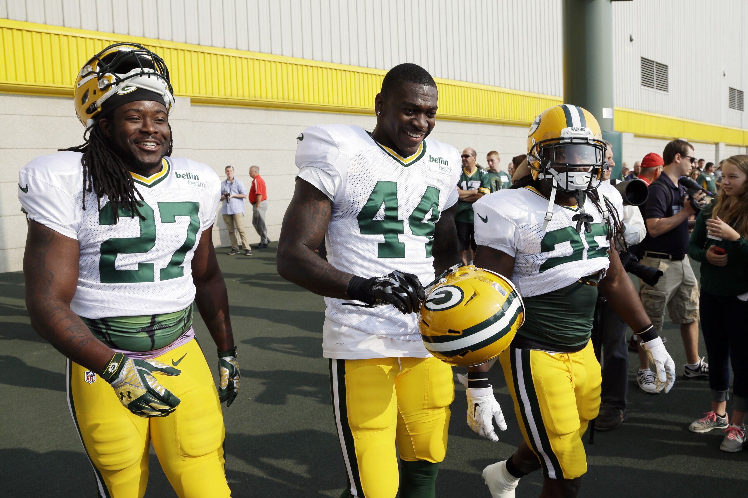 Green Bay Packers’ Eddie Lacy (27), James Starks (44) and DuJuan Harris walk on the field for NFL football training camp Monday, July 28, 2014, in Green Bay, Wis. (AP Photo/Morry Gash)