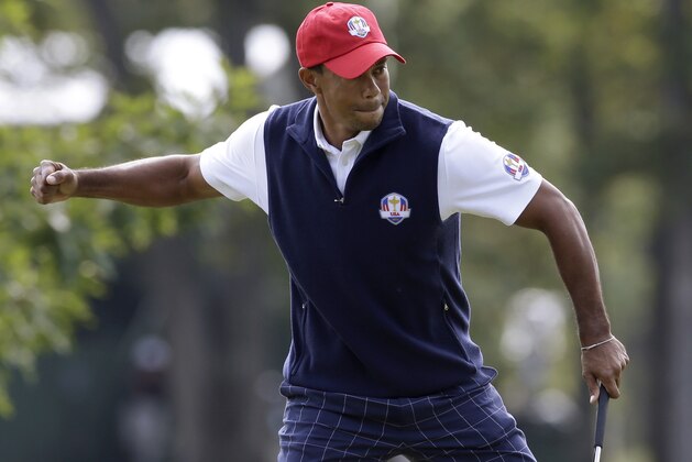 USA's Tiger Woods reacts after making a putt on the first hole during a four-ball match at the Ryder Cup PGA golf tournament Friday, Sept. 28, 2012, at the Medinah Country Club in Medinah, Ill. (AP Photo/Chris Carlson)
