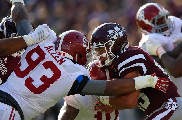 STARKVILLE, MS - NOVEMBER 14:  Jonathan Allen #93 and Reuben Foster #10 of the Alabama Crimson Tide tackle Dak Prescott #15 of the Mississippi State Bulldogs at Davis Wade Stadium on November 14, 2015 in Starkville, Mississippi.  (Photo by Kevin C. Cox/Getty Images)