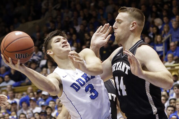 Duke's Grayson Allen (3) is pressured by Bryant's Andrew Scocca (44) during the first half of an NCAA college basketball game in Durham, N.C., Saturday, Nov. 14, 2015. Duke won 113-75. (AP Photo/Gerry Broome)