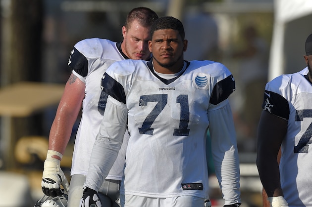 Dallas Cowboys offensive tackle La'el Collins walks off the field after a joint NFL football training camp with the St. Louis Rams, Tuesday, Aug. 18, 2015, in Oxnard, Calif. (AP Photo/Mark J. Terrill)