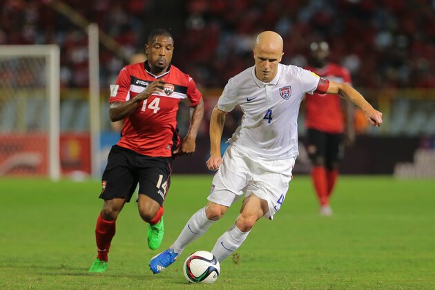 PORT OF SPAIN, TRINIDAD & TOBAGO - NOVEMBER 17: Usa's captain Michael Bradley #4 makes an attacking run as T&T's Andre Boucaud #14 chases during a World Cup Qualifier between Trinidad and Tobago and USA as part of the FIFA World Cup Qualifiers for Russia 2018 at Hasely Crawford Stadium on November 17, 2015 in Port of Spain, Trinidad & Tobago. (Photo by Ashley Allen Getty Images)