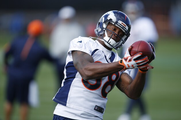 FILE - In this Wednesday, Nov. 4, 2015, file photograph, Denver Broncos wide receiver Demaryius Thomas pulls in pass during an NFL football practice session at the team's headquarters in Englewood, Colo. Thomas, who had hoped to have his mother, Katina Smith, fly to Denver for Sunday's home game against the Kansas City Chiefs, will have to delay his plans since his mother is under a 60-day travel restriction following her release from a halfway house in Georgia. (AP Photo/David Zalubowski, file) FILE - In this Wednesday, Nov. 4, 2015, file photograph, Denver Broncos wide receiver Demaryius Thomas pulls in pass during an NFL football practice session at the team's headquarters in Englewood, Colo. Thomas, who had hoped to have his mother, Katina Smith, fly to Denver for Sunday's home game against the Kansas City Chiefs, will have to delay his plans since his mother is under a 60-day travel restriction following her release from a halfway house in Georgia. (AP Photo/David Zalubowski, file)
