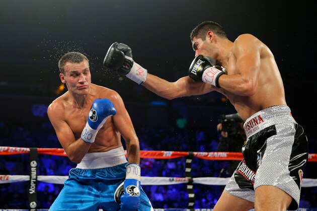 BROOMFIELD, CO - JANUARY 24:  Gilberto Ramirez (R) lands a punch against Maxim Vlasov during a Light Heavyweight match at First Bank Center on January 24, 2015 in Broomfield, Colorado. Ramirez won by unanimous decision. (Photo by Justin Edmonds/Getty Images)