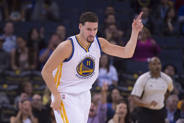 November 9, 2015; Oakland, CA, USA; Golden State Warriors guard Klay Thompson (11) celebrates after making a basket against the Detroit Pistons during the fourth quarter at Oracle Arena. The Warriors defeated the Pistons 109-95. Mandatory Credit: Kyle Terada-USA TODAY Sports