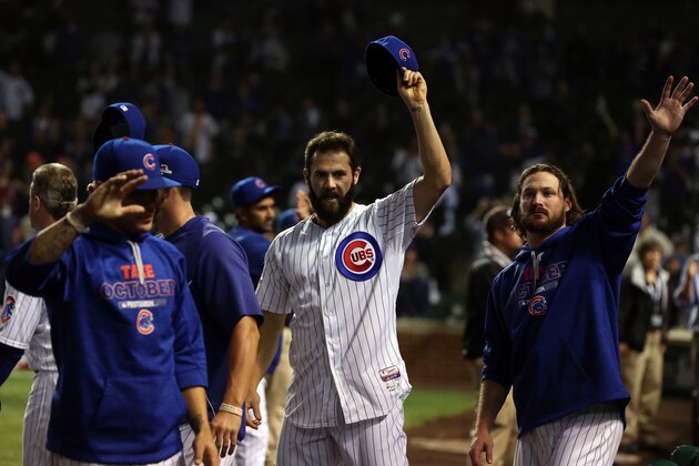 CHICAGO, IL - OCTOBER 21:  Jake Arrieta #49 of the Chicago Cubs and his teammates wave to the crowd after being defeated by the New York Mets in game four of the 2015 MLB National League Championship Series at Wrigley Field on October 21, 2015 in Chicago, Illinois.  The Mets defeated the Cubs with a score of 8 to 3 to sweep the Championship Series.  (Photo by Jonathan Daniel/Getty Images)