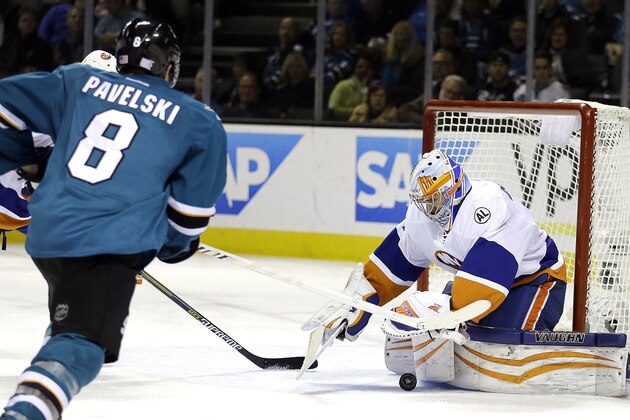 New York Islanders goalie Thomas Greiss, right, blocks a shot from San Jose Sharks' Joe Pavelski (8) during the third period of an NHL hockey game Tuesday, Nov. 10, 2015, in San Jose, Calif. New York won 4-2. (AP Photo/Ben Margot)