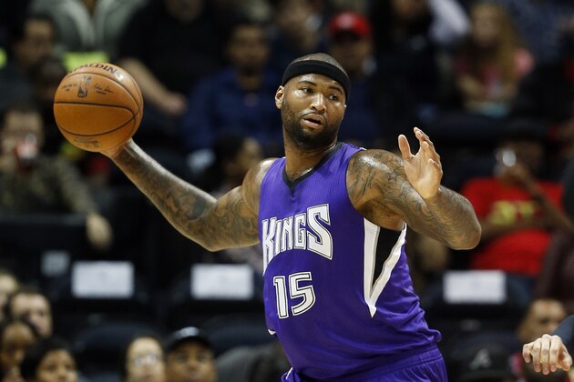 Sacramento Kings forward DeMarcus Cousins (15) grabs a rebound in the first half of an NBA  basketball game against the Atlanta Hawks  Wednesday, Nov. 18, 2015, in Atlanta. (AP Photo/John Bazemore)