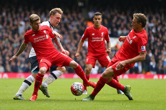 LONDON, ENGLAND - OCTOBER 17:  Christian Eriksen of Tottenham Hotspur battles with Alberto Moreno and Lucas Leiva of Liverpool as Philippe Coutinho looks on during the Barclays Premier League match between Tottenham Hotspur and Liverpool at White Hart Lane on October 17, 2015 in London, England.  (Photo by Catherine Ivill - AMA/Getty Images)
