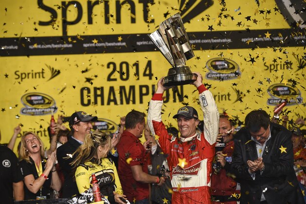 HOMESTEAD, FL - NOVEMBER 16: Kevin Harvick, driver of the #4 Budweiser Chevrolet,  celebrates in victory lane after winning during the NASCAR Sprint Cup Series Ford EcoBoost 400 at Homestead-Miami Speedway on November 16, 2014 in Homestead, Florida.