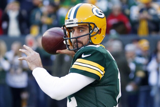 FILE - In this Sunday, Nov. 15, 2015 file photo, Green Bay Packers quarterback Aaron Rodgers warms up before an NFL football game against the Detroit Lions in Green Bay, Wis. The physical toll of the long NFL season is catching up to Green Bay Packers quarterback Aaron Rodgers. Coach Mike McCarthy said before practice on Wednesday, Nov. 18, 2015 that his quarterback was “banged up.” (AP Photo/Mike Roemer, File) FILE - In this Sunday, Nov. 15, 2015 file photo, Green Bay Packers quarterback Aaron Rodgers warms up before an NFL football game against the Detroit Lions in Green Bay, Wis. The physical toll of the long NFL season is catching up to Green Bay Packers quarterback Aaron Rodgers. Coach Mike McCarthy said before practice on Wednesday, Nov. 18, 2015 that his quarterback was “banged up.” (AP Photo/Mike Roemer, File)