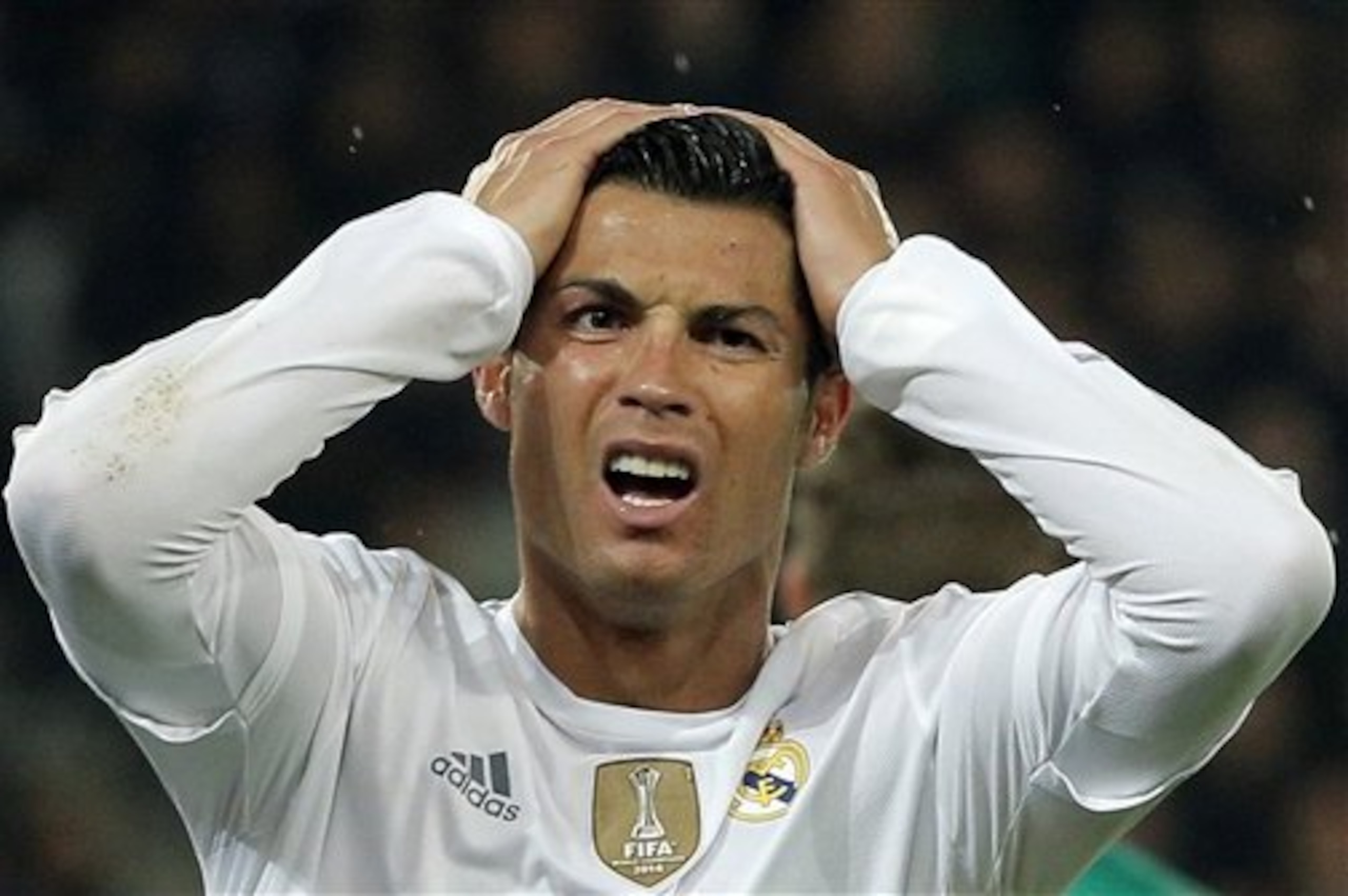 Real Madrid's Cristiano Ronaldo reacts after missing a goal during the Champions League group A soccer match between Paris St Germain and Real Madrid at the Parc des Princes stadium in Paris, Wednesday, Oct. 21, 2015. (AP Photo/Thibault Camus)