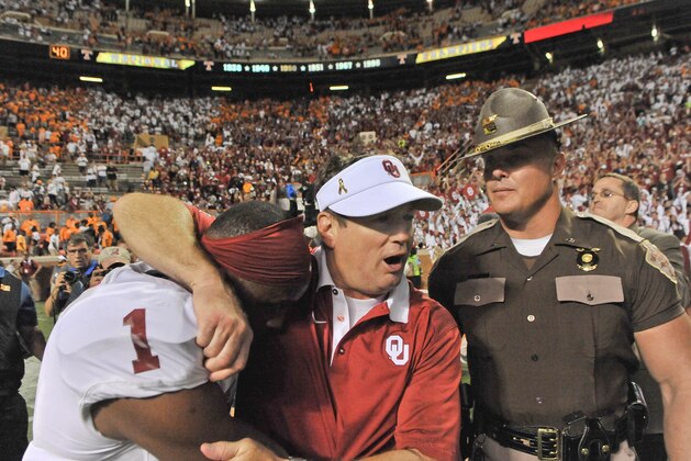 Sep 12, 2015; Knoxville, TN, USA; Oklahoma Sooners head coach Bob Stoops celebrates with wide receiver Jarvis Baxter (1) after defeating the Tennessee Volunteers in double overtime at Neyland Stadium. Oklahoma won 31-24. Mandatory Credit: Jim Brown-USA TODAY Sports