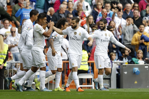 Real Madrid's Francisco Roman “Isco”, right, celebrates with teammates after scoring the opening goal against Las Palmas during the Spanish La Liga soccer match between Real Madrid and Las Palmas at the Santiago Bernabeu stadium in Madrid, Saturday, Oct. 31, 2015. (AP Photo/Francisco Seco) Real Madrid's Francisco Roman “Isco”, right, celebrates with teammates after scoring the opening goal against Las Palmas during the Spanish La Liga soccer match between Real Madrid and Las Palmas at the Santiago Bernabeu stadium in Madrid, Saturday, Oct. 31, 2015. (AP Photo/Francisco Seco)