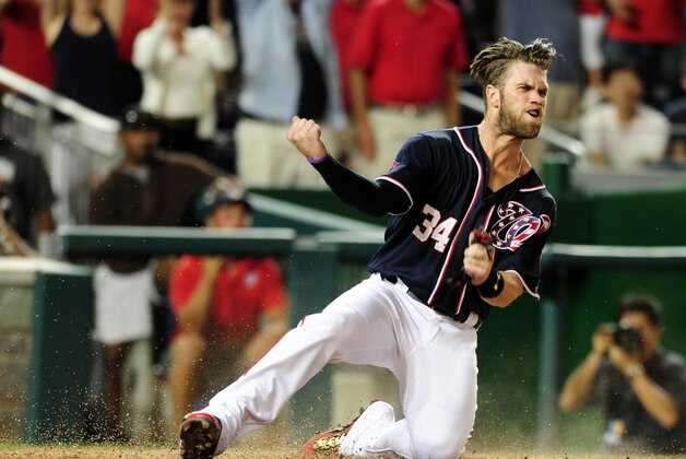 Sep 18, 2015; Washington, DC, USA; Washington Nationals outfielder Bryce Harper (34) reacts after scoring a run in the eighth inning against the Miami Marlins at Nationals Park. Mandatory Credit: Evan Habeeb-USA TODAY Sports