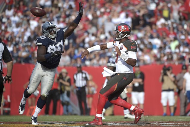 Tampa Bay Buccaneers quarterback Jameis Winston (3) throws a pass in front of Dallas Cowboys defensive end Demarcus Lawrence (90) during the second half of an NFL football game in Tampa, Fla., Sunday, Nov. 15, 2015. The Buccaneers won 10-6. (AP Photo/Phelan M. Ebenhack)