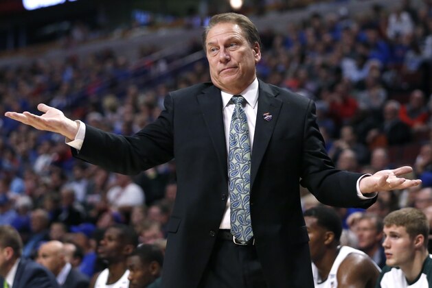 Michigan State head coach Tom Izzo reacts as he watches his team during the second half of an NCAA college basketball game against Kansas on Tuesday, Nov. 17, 2015. (AP Photo/Charles Rex Arbogast)
