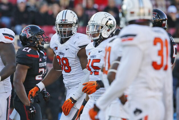Oklahoma State defensive end Emmanuel Ogbah (38) is pictured during an NCAA college football game against Texas Tech in Lubbock, Texas, Saturday, Oct. 31, 2015. Oklahoma State won 70-53. (AP Photo/Sue Ogrocki)