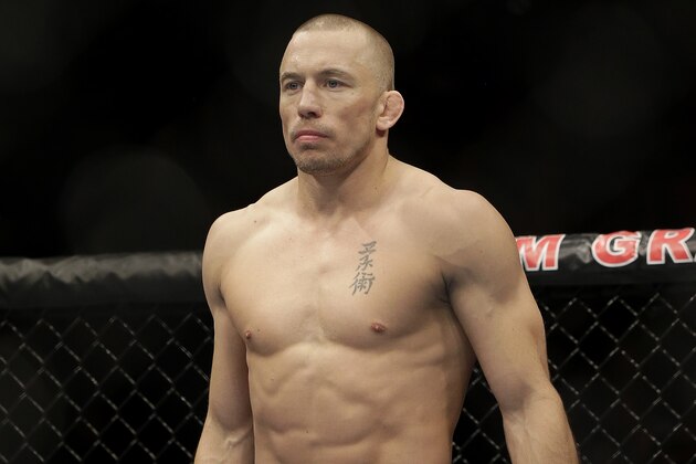 Georges St. Pierre, of Canada, waits to begin a UFC 167 mixed martial arts championship welterweight bout against Johny Hendricks on Saturday, Nov. 16, 2013, in Las Vegas. St. Pierre won by split decision. (AP Photo/Isaac Brekken)