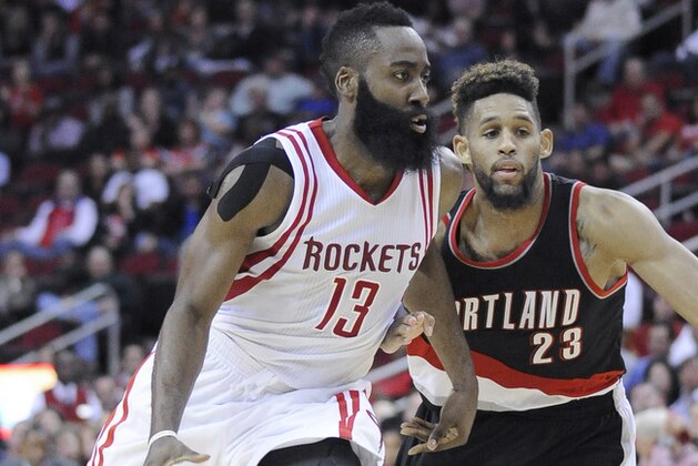 Houston Rockets' James Harden (13) drives the ball past Portland Trail Blazers' Allen Crabbe (23) in the second half of an NBA basketball game, Wednesday, Nov. 18, 2015, in Houston. The Rockets won 108-103 in overtime. (AP Photo/Pat Sullivan)